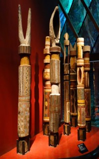 painted wooden, tribal funerary posts, made by the Tiwi people of Bathurst Island, Australia.