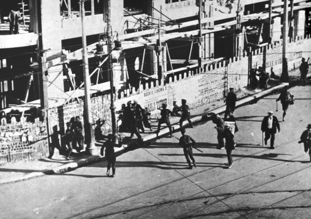 Soldiers attack a group of revolutionary strikers in Madrid.