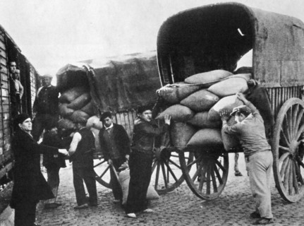 Grain supplies are transferred from carts to rail trucks