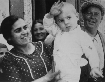 Nationalist supporters salute soldiers during the Spanish Civil War