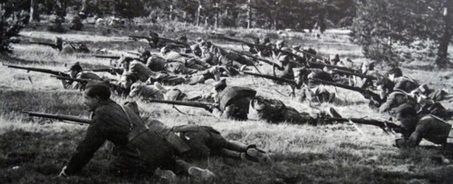 Nationalist soldiers advance in battle, during the Spanish Civil War
