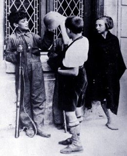 Children play like soldiers, during the Spanish Civil War