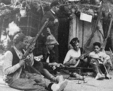 soldiers playing music during a break in hostilities during the Spanish Civil War