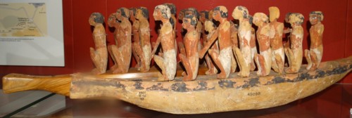 Model boat with crew of paddlers