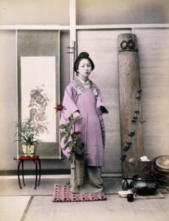 Photograph shows a portrait of a young woman
