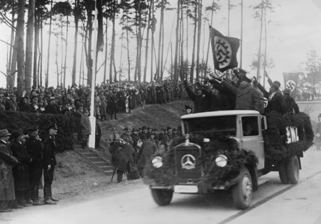 Men in a truck saluting Hermann Göring