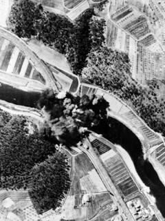 Allied bombers blow up a Nazi bridge near Florence