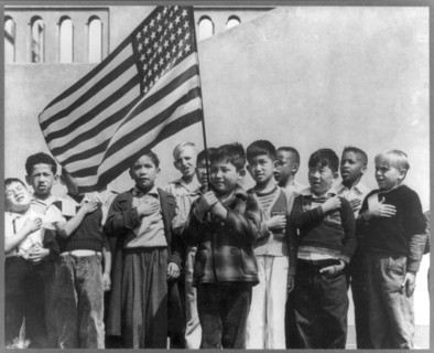 Children at the Weill public school for the international settlement saluting the flag