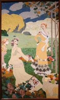 Ceramic mosaic depicting women with a fruit basket under a grapevine