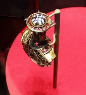 part of the boss from a shield, the lid to a Christian chalice, or the stopper to a drinking horn. from the Staffordshire Hoard. Anglo-Saxon. 7th or 8th centuries