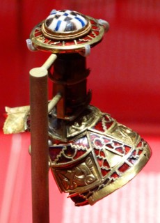 part of the boss from a shield, the lid to a Christian chalice, or the stopper to a drinking horn. from the Staffordshire Hoard. Anglo-Saxon. 7th or 8th centuries