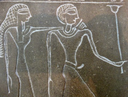 Stone tablet with reliefs and hieroglyphs