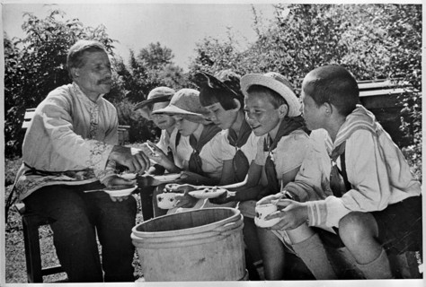 USSR Children on a Soviet collective farm, tasting honey