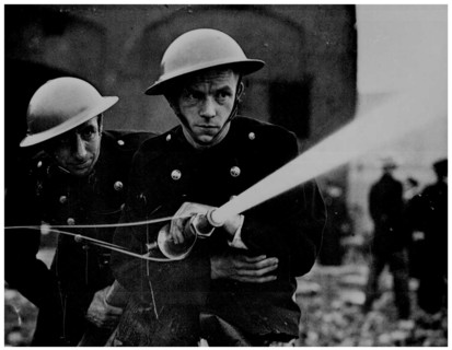 British firefighters in a bombed area in England, World War Two, 1943