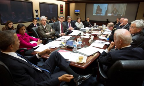 President Obama conveying a National Security Council meeting in the Situation Room of the White House to discuss matters in Ukraine