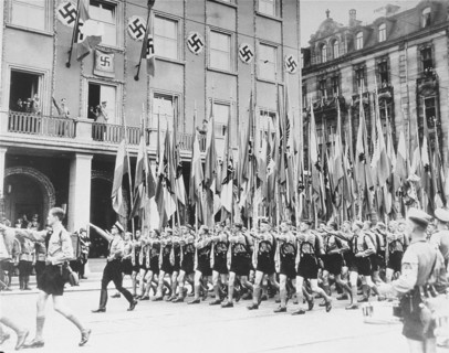 Photograph of Hitler Youth members marching in celebration of Adolf Hitler's Birthday