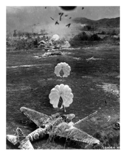 Photograph of a Mitsubishi Ki-21 under attack on airfield