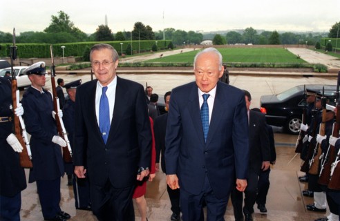 Photograph of Secretary of Defense Donald H. Rumsfeld escorting Senior Minister Lee Kuan Yew,