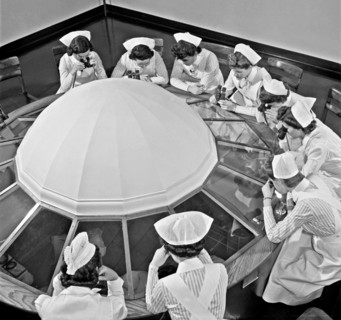 Photograph of student nurses observing an operation