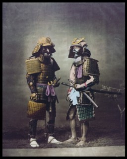 Hand-coloured photograph of Japanese men by Felice Beato