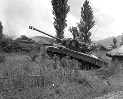 US Marine Corps Pershing tank at the edge of a village in Korea, 4 Sep 1950