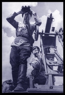 Soviet Russian Anti Aircraft gunners scan the skies while wearing gas masks during World War Two. 1941