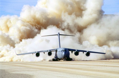 Photograph of the clouds of dust behind US Air Force C-17 Globemaster III at Fort Irwin, California