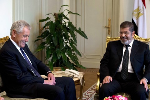 Photograph of United States Secretary of Defense Chuck Hagel meeting with Egyptian President Mohamed Morsi in Cairo