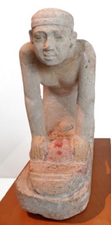 statue of a servant grinding crops. Limestone. Old Kingdom, 5th Dynasty (2465-2323 B.c.)