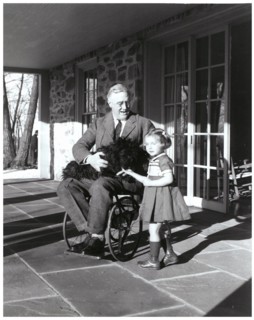 US President Franklin Roosevelt holds his dog