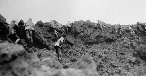World War One German infantry advance from a trench under allied gunfire. 1915