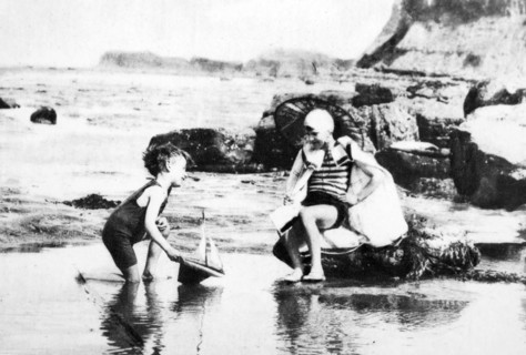 Young boys paly in a tidal pool on an English beach 1928