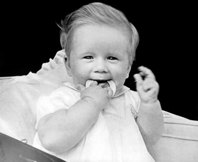 Teething baby with a teeth ring