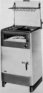 The 'Belling' electric cooker with inner door of armour and a plated glass door