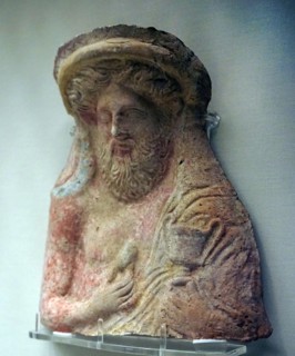 Dionysos holding a kantharos and an egg