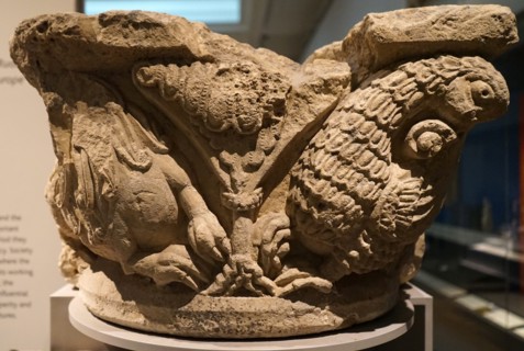 Stone capital with lion and griffin