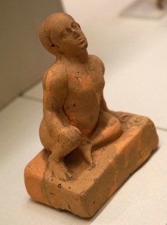 Terracotta figure of a squatting infant from the Archaic period