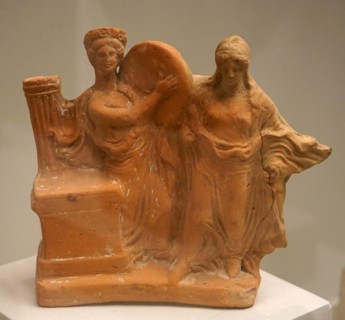 Terracotta carving on dancers at an altar