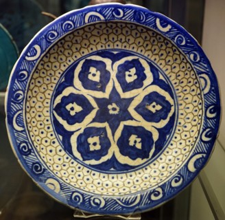 Bowl with six-petalled floral design and scale pattern