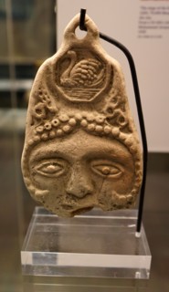 Double-sided plaque with face