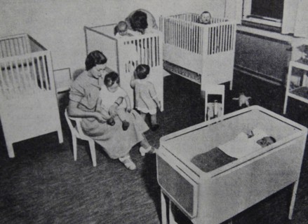 Photograph of nurses caring for children and infants at a child care centre