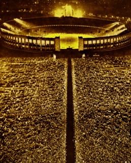 the large crowds gathered within the Berlin Stadium celebrating the visit of Benito Mussolini