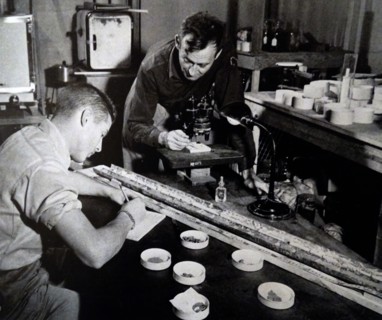 a young boy studying samples from the sea floor