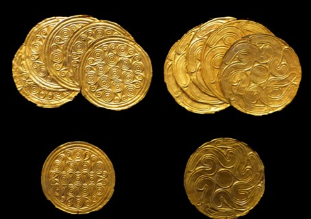 Gold roundels depicting leaves in repose