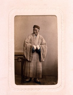 Studio portrait of a Chinese Buddhist priest