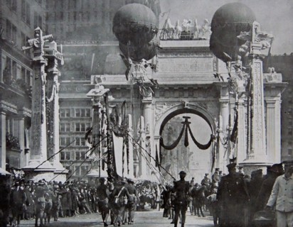 American troops marching under a Victory Arch in New York.