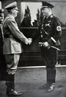 Adolf Hitler is met by Richard Walther Darré