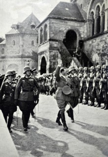 Adolf Hitler with an honour guard in 1934