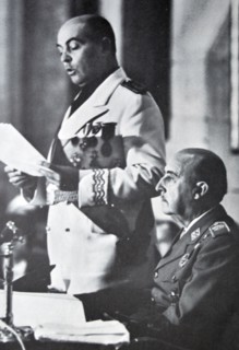 General Franco sits and listens to José Solís Ruiz