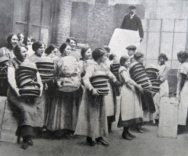 Loading soldiers helmets for delivery to the front line